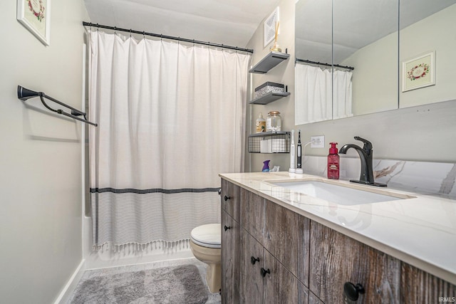 full bathroom with vanity, shower / tub combo with curtain, and toilet