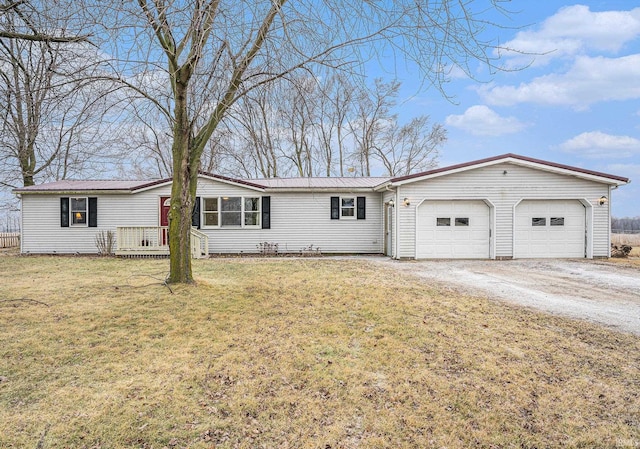 view of front of house with a garage and a front yard