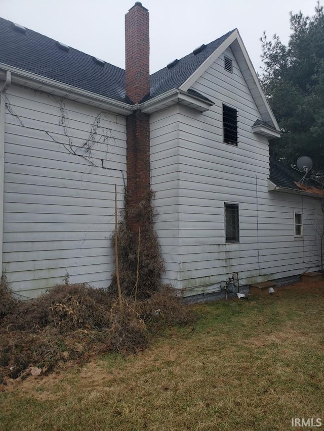 view of home's exterior featuring a lawn