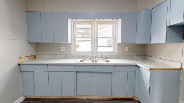 kitchen with a sink and light countertops