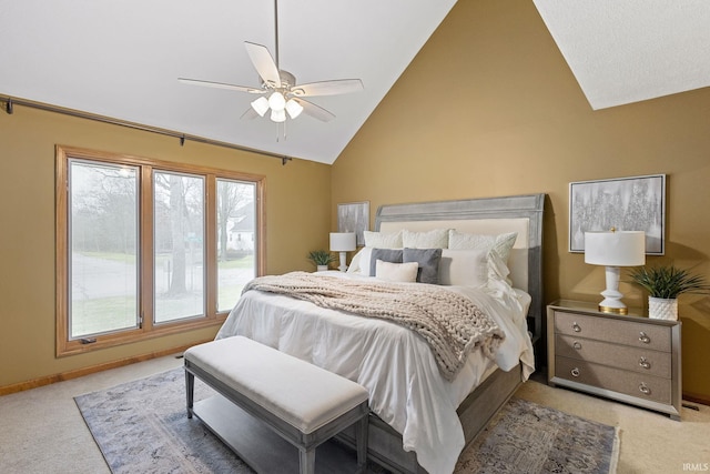 bedroom featuring lofted ceiling, light colored carpet, and ceiling fan