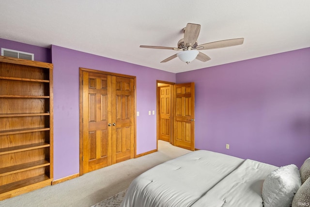 carpeted bedroom with ceiling fan