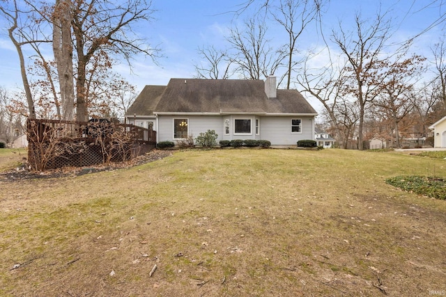 back of house with a yard and a deck