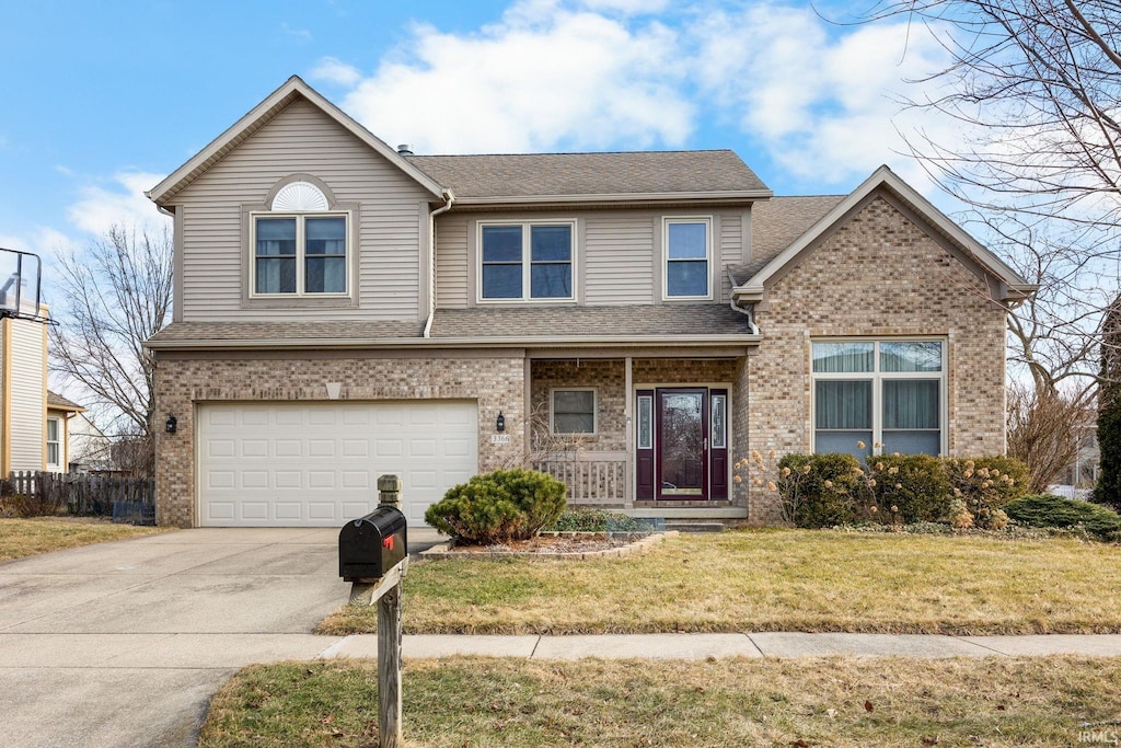 view of front facade with a garage and a front yard