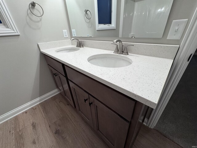 bathroom featuring vanity and wood-type flooring