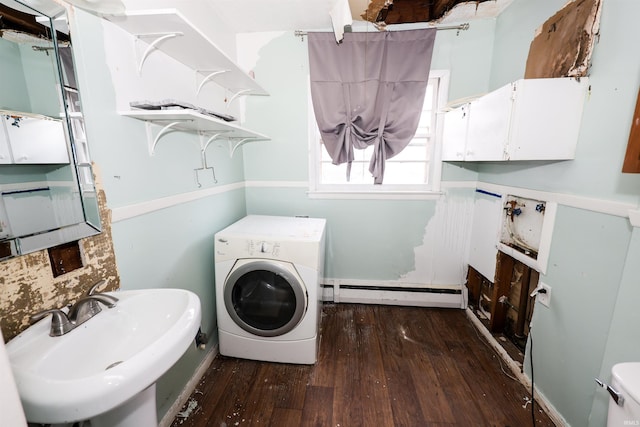 washroom with washer / clothes dryer, a baseboard heating unit, sink, and dark hardwood / wood-style flooring