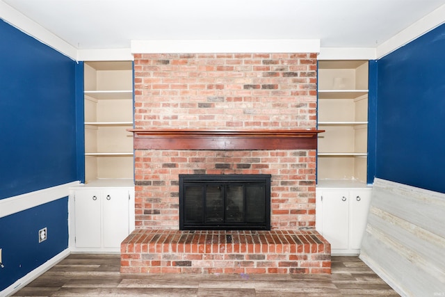 unfurnished living room featuring dark hardwood / wood-style floors and a fireplace