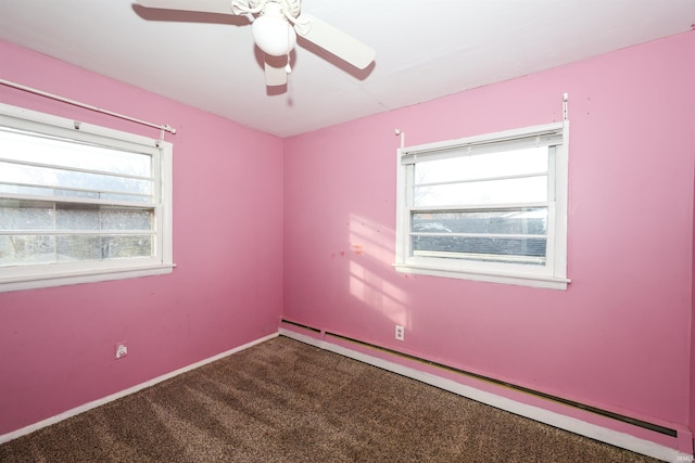 unfurnished room with baseboard heating, ceiling fan, a healthy amount of sunlight, and carpet