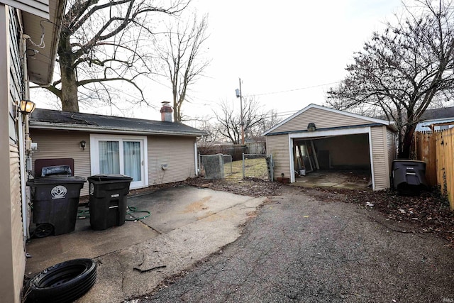 exterior space with an outbuilding and a garage