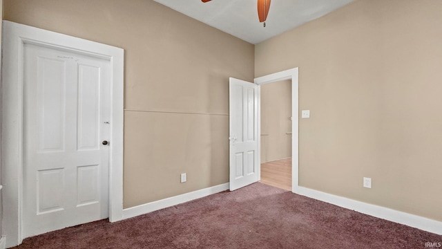 unfurnished bedroom with ceiling fan and carpet flooring