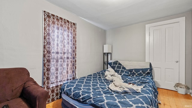 bedroom with hardwood / wood-style floors