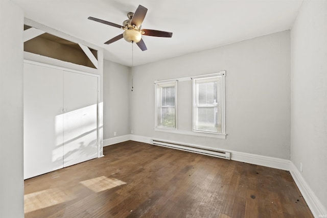 spare room with hardwood / wood-style floors, ceiling fan, and baseboard heating