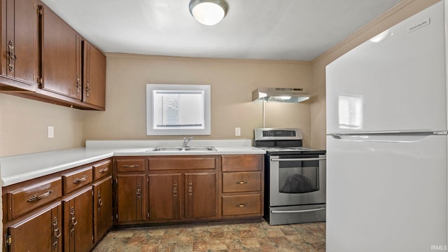 kitchen featuring sink, electric range, and white refrigerator