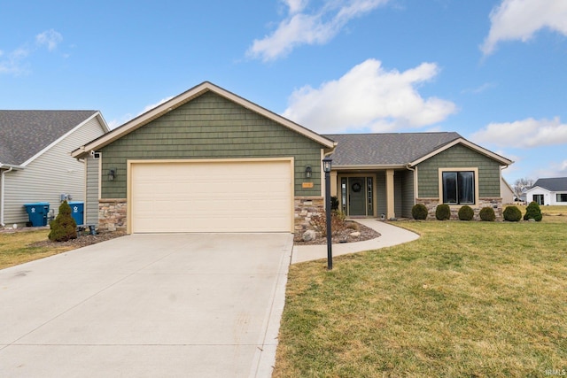 view of front of property with a garage and a front lawn