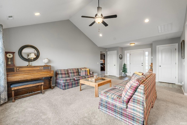 carpeted living room featuring high vaulted ceiling and ceiling fan