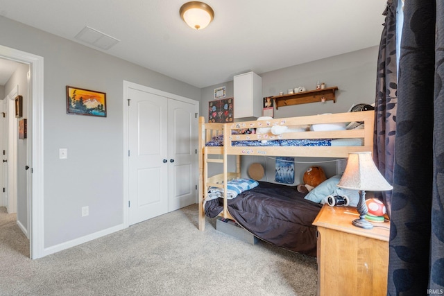 carpeted bedroom with a closet