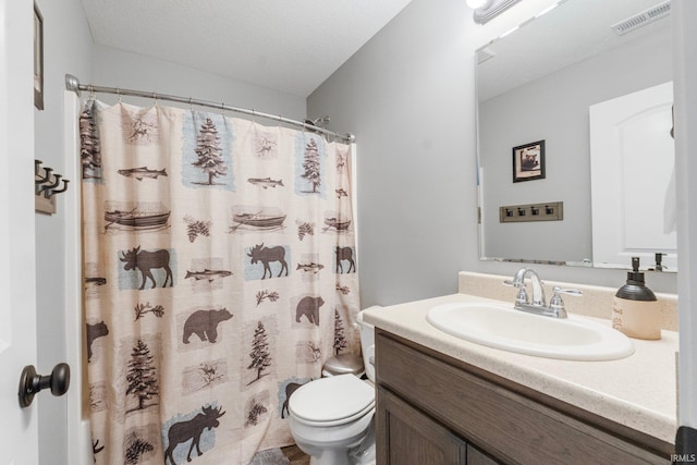 bathroom with vanity, a textured ceiling, toilet, and a shower with shower curtain