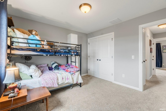 bedroom featuring a closet and carpet