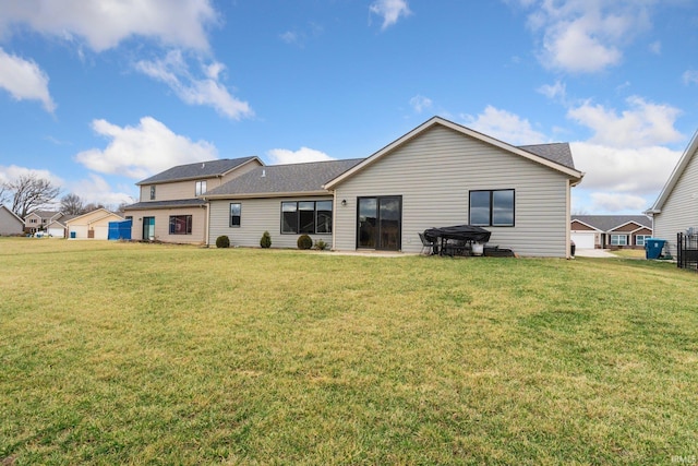 rear view of house with a lawn