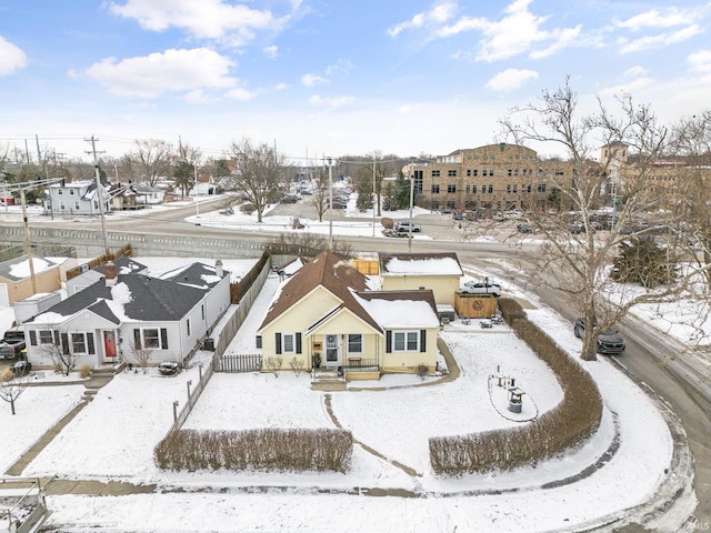 snowy aerial view featuring a residential view