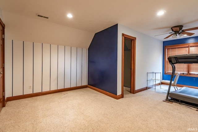 interior space with light carpet and ceiling fan