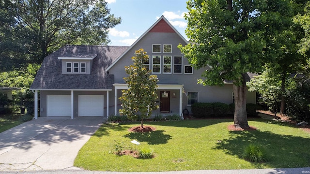 view of front of property featuring a garage and a front lawn