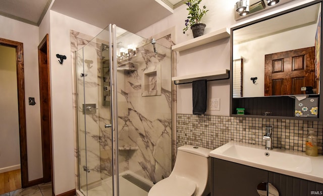 bathroom with tasteful backsplash, vanity, an enclosed shower, and toilet