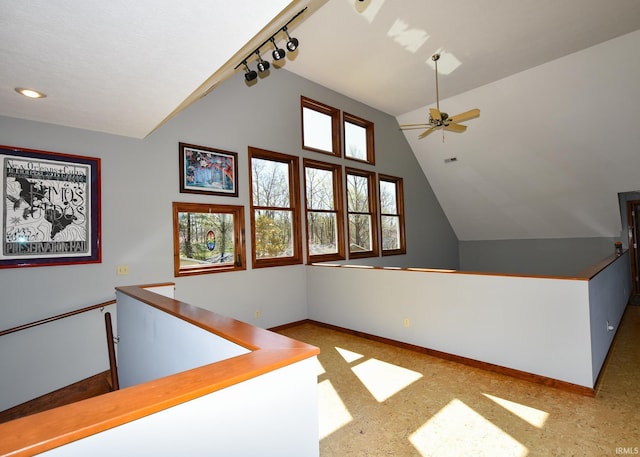 additional living space with ceiling fan and vaulted ceiling