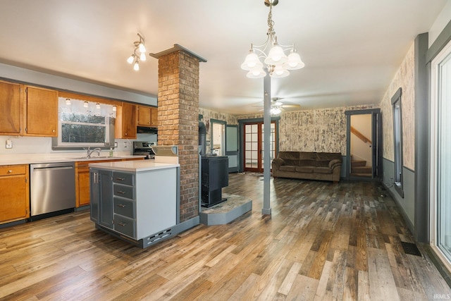 kitchen featuring appliances with stainless steel finishes, dark hardwood / wood-style flooring, and a wealth of natural light