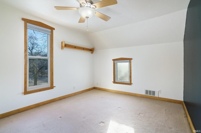 additional living space with ceiling fan, lofted ceiling, and carpet floors