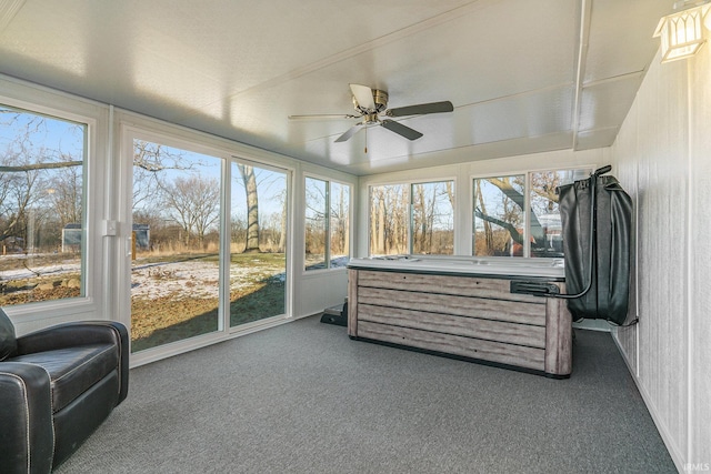 sunroom featuring ceiling fan