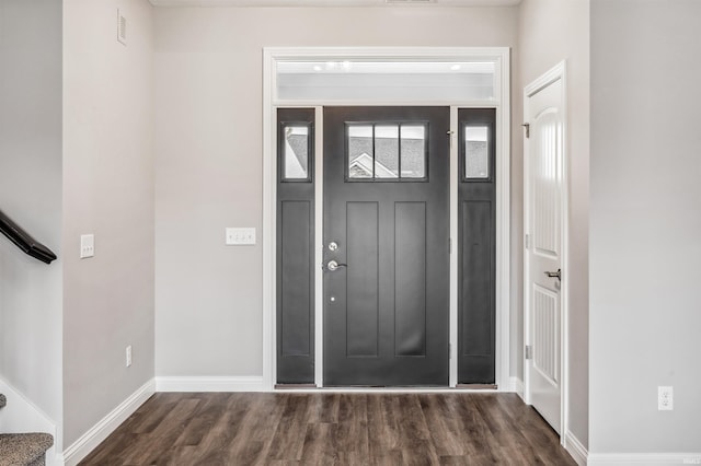 foyer entrance with dark hardwood / wood-style flooring