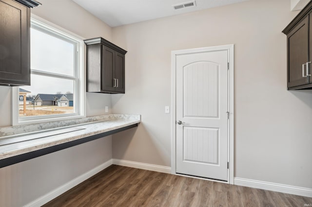 laundry area featuring dark hardwood / wood-style floors