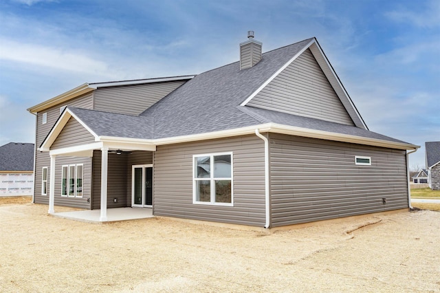 rear view of property featuring a patio area