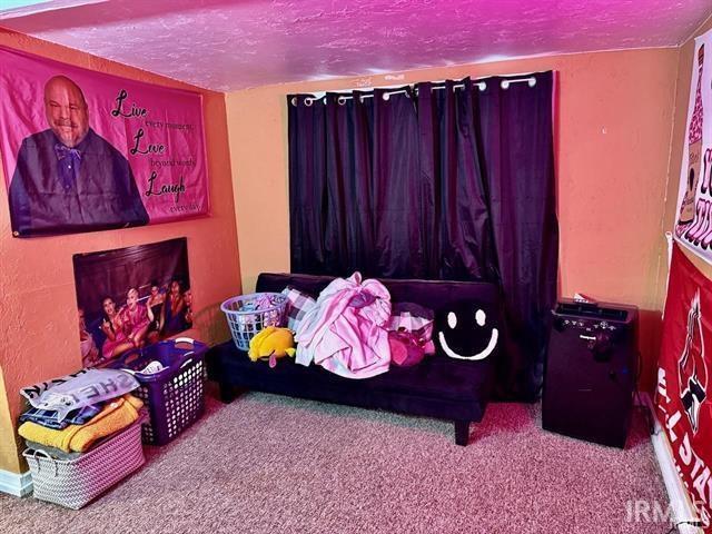 carpeted bedroom with a textured ceiling