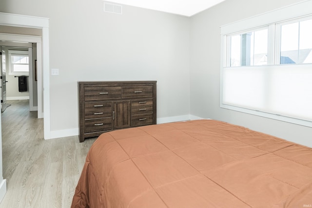 bedroom with light hardwood / wood-style flooring