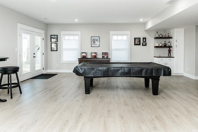 game room with french doors, pool table, and light hardwood / wood-style flooring