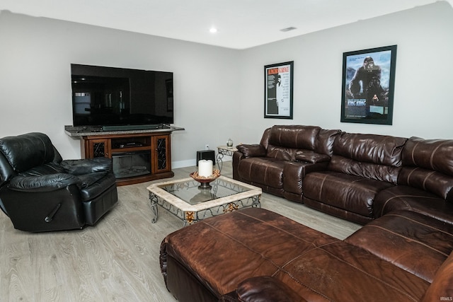 living room with light hardwood / wood-style flooring