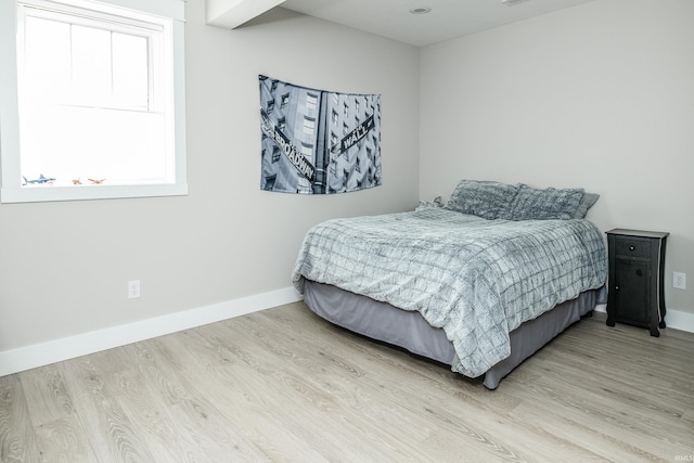 bedroom with light wood-type flooring