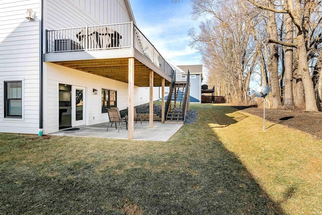 back of house featuring a yard and a patio area