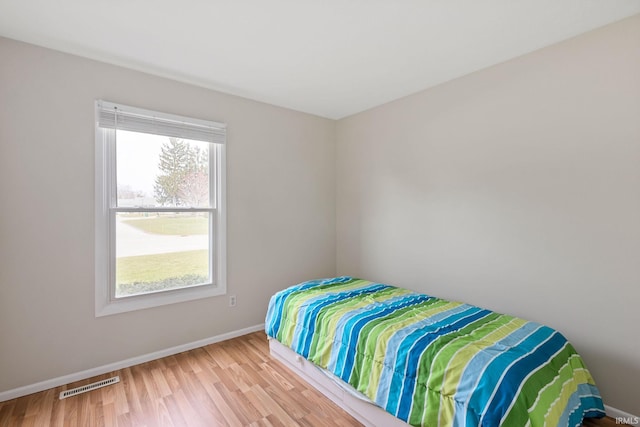 bedroom with light hardwood / wood-style floors