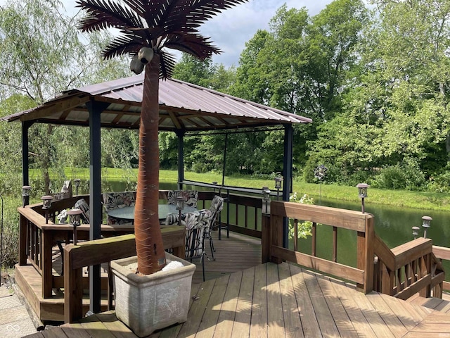 deck with a gazebo and a water view