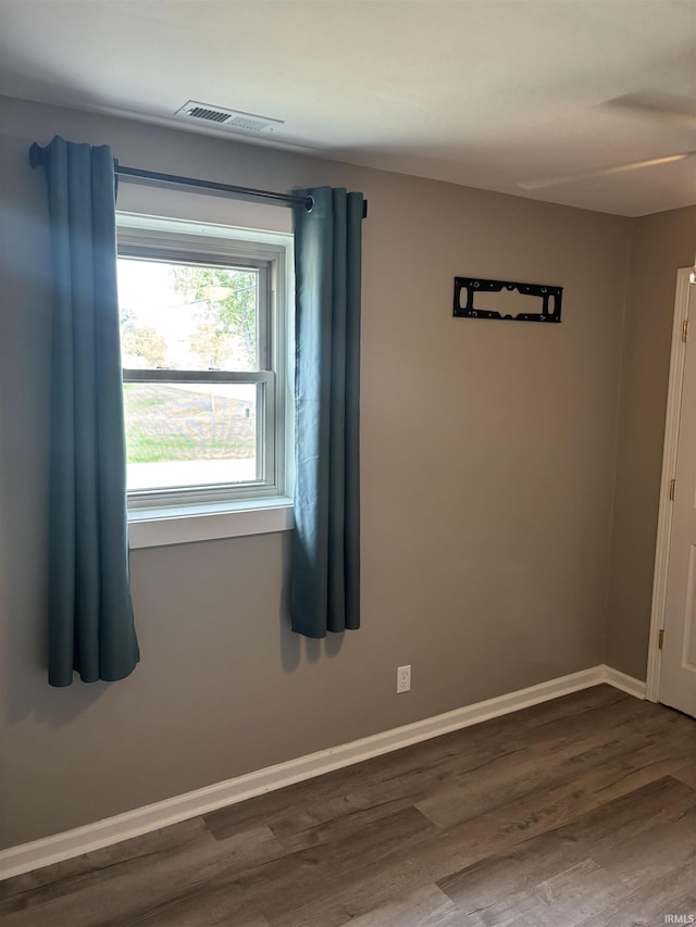 empty room featuring dark hardwood / wood-style floors