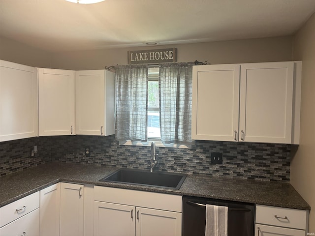 kitchen with sink, decorative backsplash, white cabinets, and dishwasher