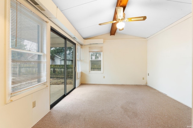 carpeted spare room with vaulted ceiling with beams and ceiling fan