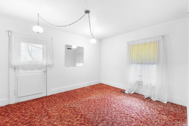 empty room featuring carpet floors