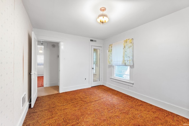 view of carpeted spare room