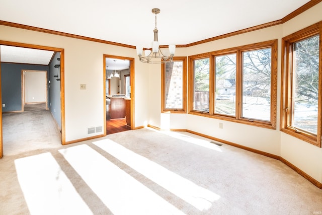 interior space featuring crown molding, carpet floors, and a chandelier