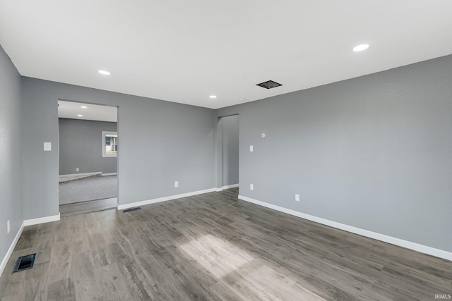 empty room featuring hardwood / wood-style flooring