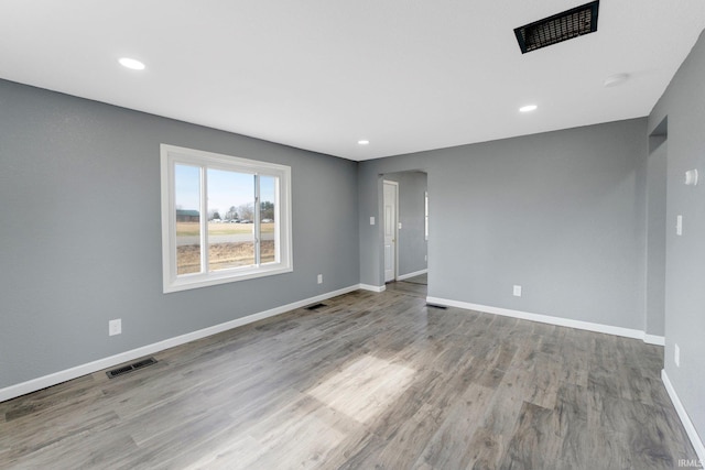 spare room featuring light hardwood / wood-style floors